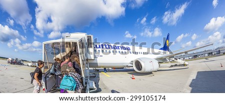 FRANKFURT, GERMANY - JULY 6, 2015: Boarding Lufthansa Jet airplane in Frankfurt airport. Lufthansa is the largest airline in Europe for overall passengers carried.