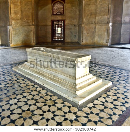 DELHI, INDIA - NOVEMBER 11, 2011: marble tomb inside  Humayuns tomb in Delhi, India. The tomb was commissioned by Humayun\'s first wife Bega Begum in 1569.