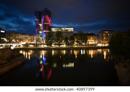 glas front of the Uniqa tower in vienna illuminated with different colors ans special effects by night, Vienna