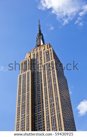 NEW YORK, USA - JULY 7: Facade of Empire State Building in the afternoon with iron statue of Man on the roof on July 7,2010 in New York, USA.