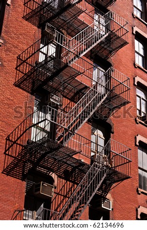 fire ladder at old beautiful houses downtown in New York