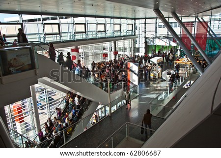 FRANKFURT, GERMANY - OCTOBER 10: public day for Frankfurt Book fair, visitors inside the fair hall on moving escalators  on October 10, 2010 in Frankfurt, Germany.
