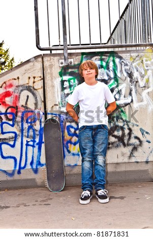 boy resting with skate board at the skate park