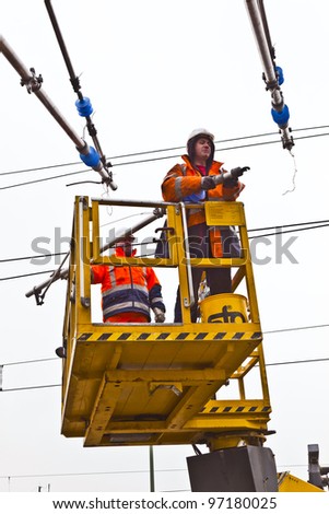 WIESBADEN, GERMANY - FEBRUARY 2:  worker repairs the catenary on February 2,2011 in Wiesbaden, Germany. The equipment is rented by Boehls, the leading rental company in Europe.