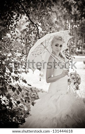 Happy young bride outside on her wedding day - Copyspace. Wedding couple - new family! wedding dress. Bridal wedding bouquet of flowers