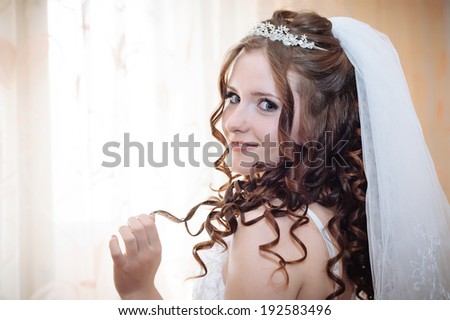 Young and sexy woman in white lingerie. bride with hairstyle and bright makeup. Happy sexy girl waiting for groom. lady in bridal dress have final preparation for wedding. Body in sexy bridal lingerie