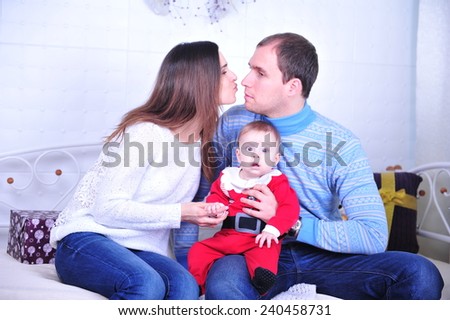 Family sitting together in Christmas interior. Happy family having fun with Christmas presents. Christmas Family Portrait, Mother And Son Celebrate Holiday, Opening Present Gift Box