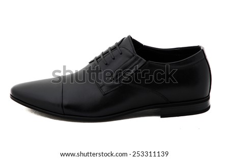 Black patent leather men shoes against white background. Male fashion with shoes on white.  The black man\'s shoes isolated on white background.