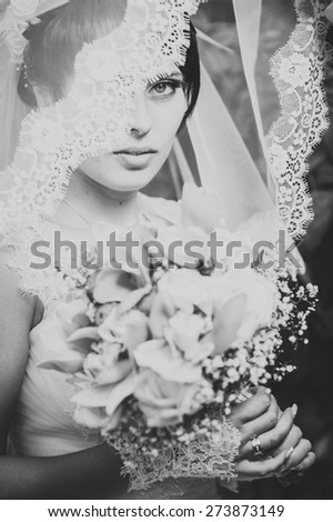 Portrait of the bride with a veil. Wedding theme
