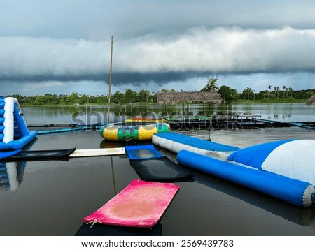 Similar – Image, Stock Photo Rubber ring on pier near lake