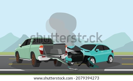 Accident of a passenger car collided with a pick-up truck. Front passenger car was damaged and smoke spewed out. Rear of the pickup truck was damaged. On asphalt road and meadow with mountain and sky.