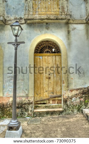 Old Grunge Door of Colonial House with Lamp Post