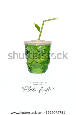 Biodegradable coffee cup, made with green sprout and leaves. Plastic free. Ecological poster. Say NO to plastic. Ban plastic pollution.
Zero waste and Sustainable lifestyle. Think Green. 
