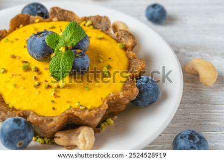 Similar – Image, Stock Photo Fresh blueberry pistachio cake with whole berries on top