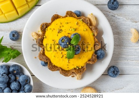 Similar – Image, Stock Photo Fresh blueberry pistachio cake with whole berries on top