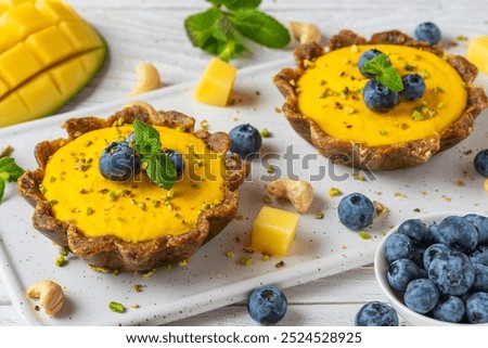 Similar – Image, Stock Photo Fresh blueberry pistachio cake with whole berries on top