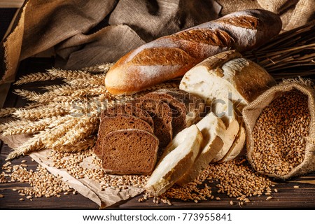 Assortment of baked bread on wooden table background Stock foto © 