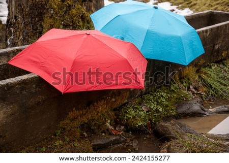 Similar – Image, Stock Photo Stretched lying umbrella with raindrops. Black and white photo