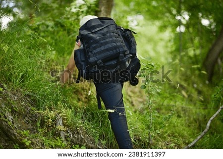 young lady walking in the forest, drinking water, taking photos Stok fotoğraf © 