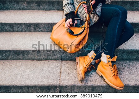 Similar – Image, Stock Photo Woman in brown boots standing on a wooden floor holding a dried artichoke flower in her hand