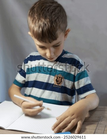 Similar – Image, Stock Photo Boy does homework