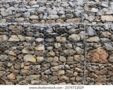 Similar – Image, Stock Photo Stone in wire mesh wall