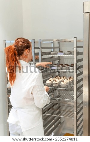 Similar – Foto Bild Nicht erkennbarer Koch legt Teig in Tasse