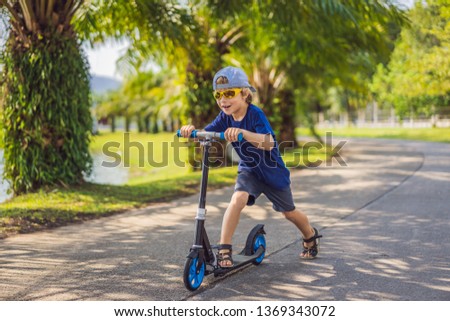 Similar – Image, Stock Photo Riding scooter in skate park