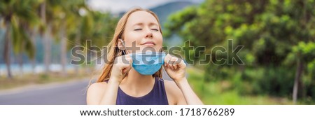 Quarantine is over concept. Woman taking off mask outdoor. We are safe. Coronavirus ended. We won. No more quarantine. Breathe deep. Take off the mask. Coronavirus is over BANNER, LONG FORMAT