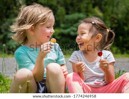 Similar – Image, Stock Photo Child with lollipop