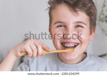 Similar – Image, Stock Photo Wooden toothbrushes with dental floss.