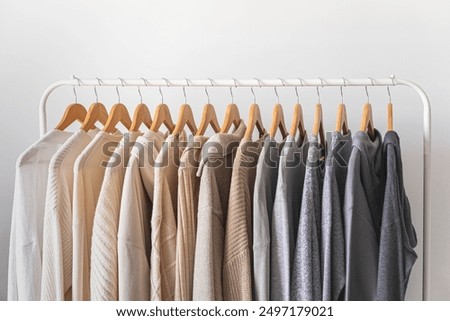 Similar – Image, Stock Photo hangers with clothes in a closet
