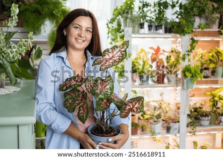 Similar – Image, Stock Photo woman gardener posing with bouquet of astilbe flowers in private garden. Country living and landscape design concept