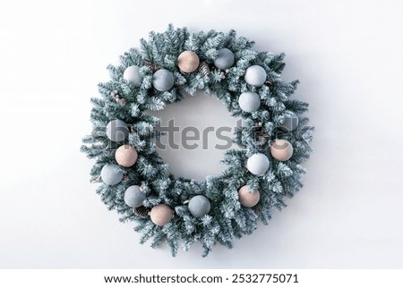 Similar – Image, Stock Photo Christmas composition. Wreath made of fir tree branches and festive pine cones on a red background, top view