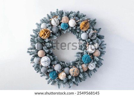 Similar – Image, Stock Photo Christmas composition. Wreath made of fir tree branches and festive pine cones on a red background, top view