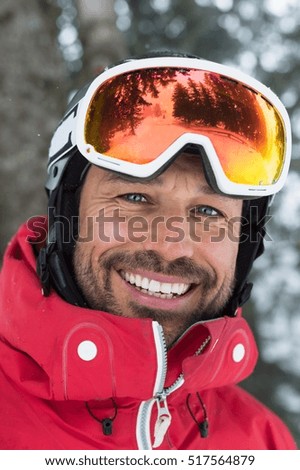 Similar – Image, Stock Photo Skier with red jacket and green backpack in icy snowy landscape walks on lonely ski track on way to mountain in evening light