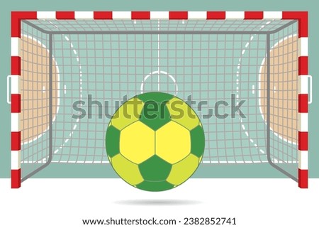 handball ball in front of goal posts with aerial view of court in background