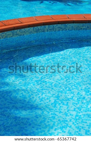 Clean water in a beautiful turquoise swimming pool detail