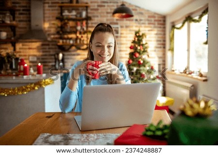 Image, Stock Photo Woman browsing laptop during online shopping at home