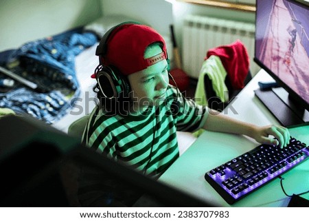 Similar – Image, Stock Photo Concentrated boy playing video game