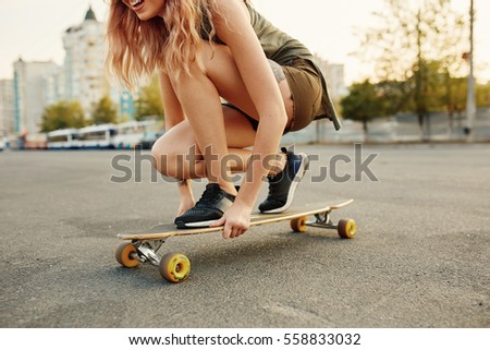 Similar – Image, Stock Photo Hipster skater sitting on skateboard near ramp