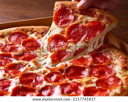 Similar – Foto Bild Pizzasalami in Scheiben geschnitten. Pizza-Peperoni-Scheiben. Hausgemachtes Abendessen