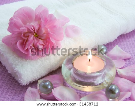 Aroma candle and petals of rose for relax