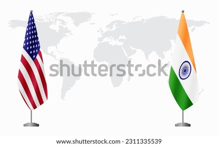 United States and India flags for official meeting against background of world map.