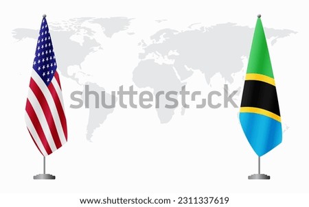 United States and Tanzania flags for official meeting against background of world map.