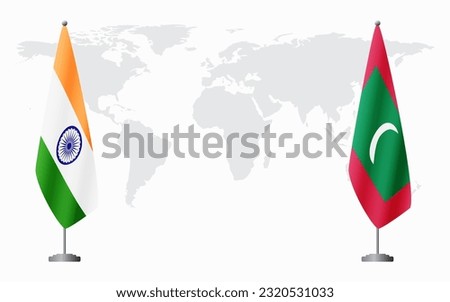 India and Maldives flags for official meeting against background of world map.