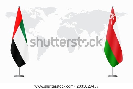 United Arab Emirates and Oman flags for official meeting against background of world map.
