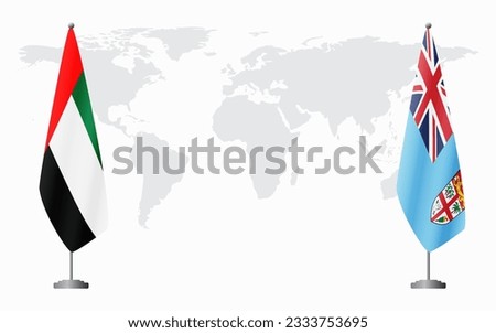 United Arab Emirates and Fiji flags for official meeting against background of world map.