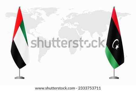 United Arab Emirates and Libya flags for official meeting against background of world map.