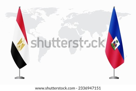 Egypt and Haiti flags for official meeting against background of world map.